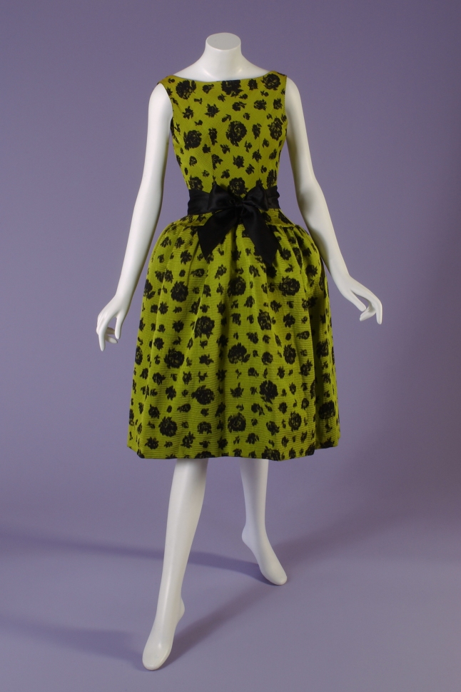 Balenciaga , Cocktail dress , 1959, Paris. Gift of Kay Kerr Uebel. 75.170.1_20050512_01 Short evening dress in chartreuse ribbed silk with black chinÈ r; with bateau neckline; bubble skirt on hip yoke; and attached black satin ribbon tie; separate coordinating black satin ribbon sash