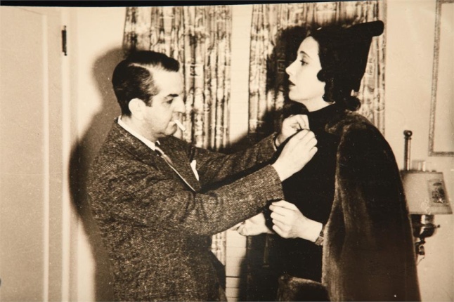 The creative ORRY-KELLY adjusts his costume for his muse Kay Francis in a scene from WOMEN HE'S UNDRESSED - A FILM BY GILLIAN ARMSTRONG